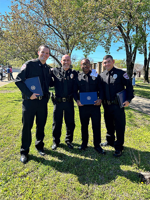 91Ƭ Assistant Police Chief Brian Locke, second from left, recently congratulated 91ƬPD officers Tyler Hawkins, left, Deveair Salter, and William Bowling on their graduation from the North Mississippi Law Enforcement Training Academy